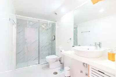 a bathroom with a shower and a toilet and a sink at ON Apartments - Palace - Free Parking in Porto
