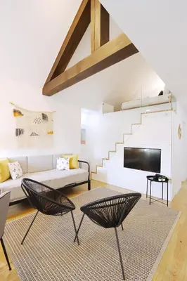 a living room with two chairs and a couch at HM - OPorto City View in Porto