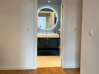 a bathroom with a sink and a mirror at RIBEIRA OPORTO APARTMENT (NEW) in Porto