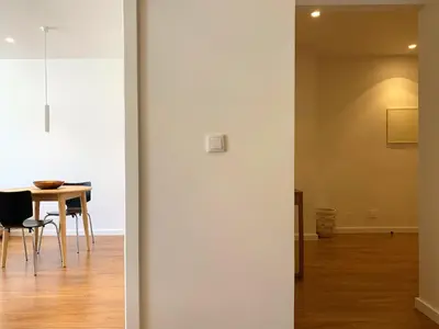 two views of a dining room and a dining room table at RIBEIRA OPORTO APARTMENT (NEW) in Porto