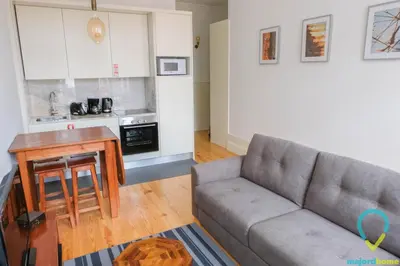 a living room with a couch and a table at Simply Porto in Porto