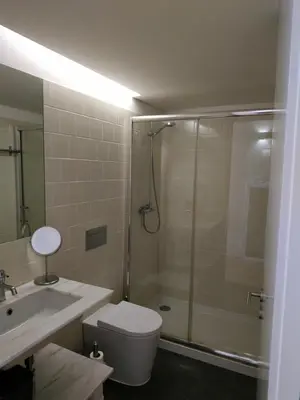 a bathroom with a shower and a toilet and a sink at ML Apartments River in Porto