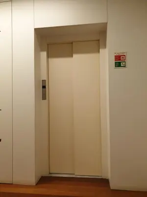 an elevator with two doors in a building at Lux Ribeira - ALL INCLUDED in Porto