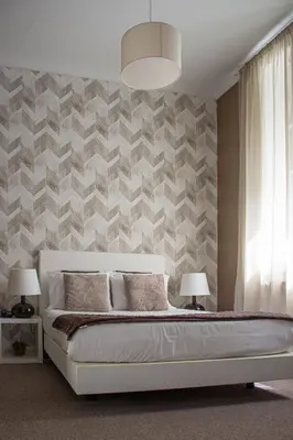 a bedroom with a bed and two lamps and a wall at O'Porto Seven - Guest House in Porto