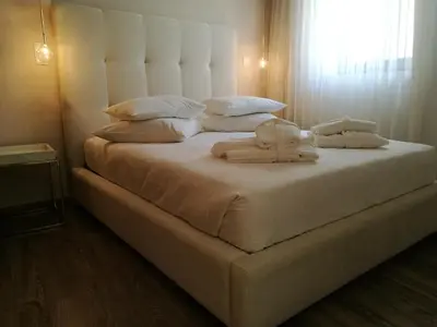 a large white bed with two towels on it at Hostel Gaia Porto in Vila Nova de Gaia