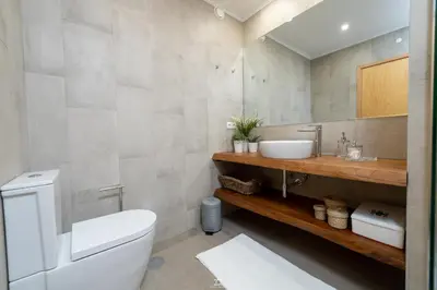 a bathroom with a toilet and a sink at Porto Cathedral in Porto