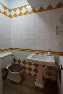 a bathroom with a toilet and a sink at Modern house - air cond, free parking, breakfast, by Porto with Love LDA in Vila Nova de Gaia