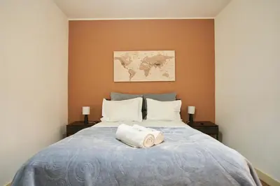 a bedroom with a bed with a towel on it at Riverside (with 3 Bedrooms) by JC in Porto