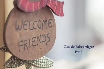 a sign with the words welcome friends written on it at Bairro Alegre, Casa do Porto in Porto