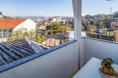 a balcony with a view of a city at Casa de Gaia in Vila Nova de Gaia