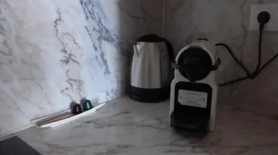 a blender sitting on a counter next to a coffee maker at The Porto Way in Porto
