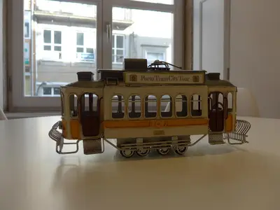 a toy train sitting on top of a table at The Porto Way in Porto