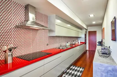 a kitchen with a red counter top in a room at Charming Bonfim Penthouse in Porto