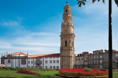 a tall clock tower in front of a building at Be Happy in Porto in Porto