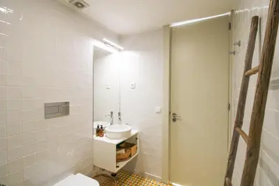 a bathroom with a sink and a toilet and a shower at Douro Divine in Porto