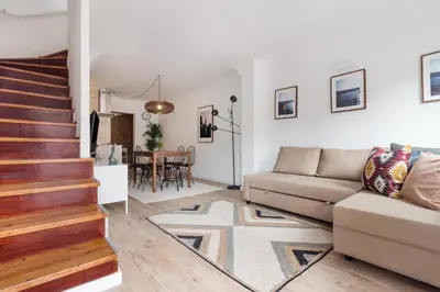 a living room with a couch and a table at Gaia Retreat • 2 BD · A/C in Vila Nova de Gaia