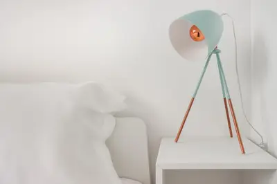 a lamp on a white table next to a pillow at Gaia Retreat • 2 BD · A/C in Vila Nova de Gaia