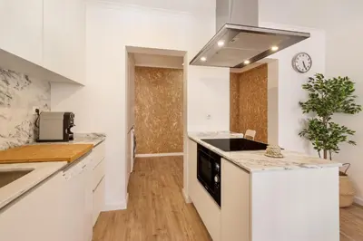 a kitchen with white counters and a stove top oven at Gaia Retreat • 2 BD · A/C in Vila Nova de Gaia