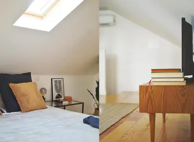 a bedroom with a bed and a tv on a table at Elisa Apartment in Porto