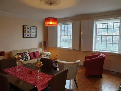 a living room with a table and a couch at Historic Oporto Apartment at oporto UNESCO area, in front of Porto Wine caves in Porto
