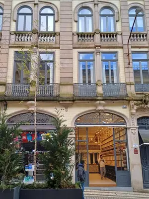 a store front of a building with windows at Apartamentos Villa Bolhao in Porto