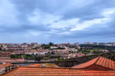 a view of a city with a river and buildings at YOUROPO - ExtendALL in Porto