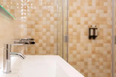 a bathroom with a sink and a shower at Marquês Deluxe Apartment in Porto