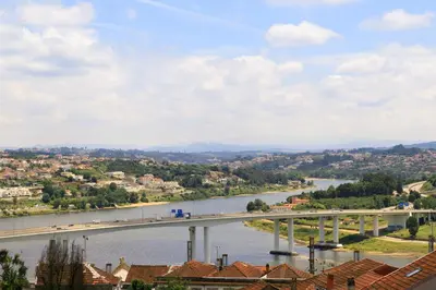 a view of a bridge over a river at Casas Da Formiga - Riverview Terrace and Pool in Porto