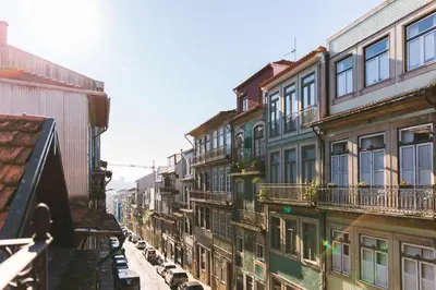 a row of buildings on a city street at APOSENTUS - Charming Center Apartment with Balcony in Porto