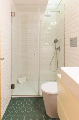 a bathroom with a shower and a toilet and a sink at APOSENTUS - Charming Center Apartment with Balcony in Porto