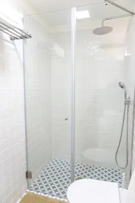 a shower with a glass door in a bathroom at Casa D'ouro in Porto