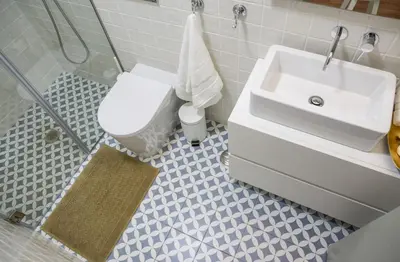 a bathroom with a white sink and a toilet at Casa D'ouro in Porto