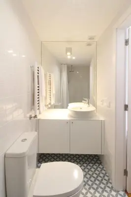 a white bathroom with a toilet and a sink at PORTO CONCEPT HOME - Paranhos in Porto