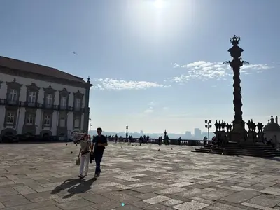 a man and woman standing in front of a building at By this River in Porto