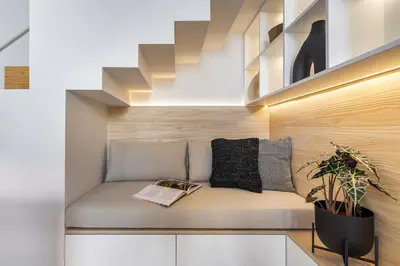 a couch with a book on it in a room at Canto De Luz - Luxury Maison in Porto
