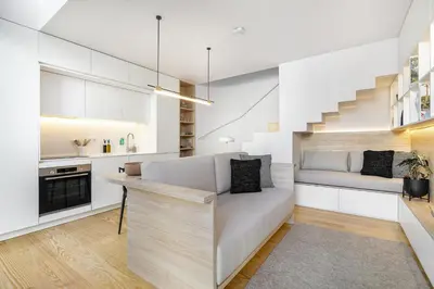 a kitchen with a couch and a bed in a room at Canto De Luz - Luxury Maison in Porto