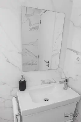 a white bathroom with a mirror and a sink at Downtown 3 Bedroom with Balcony - Quiet Street - Family Friendly - Groups in Porto