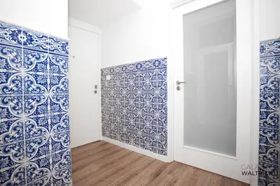 a room with blue and white walls and a door at Downtown 3 Bedroom with Balcony - Quiet Street - Family Friendly - Groups in Porto