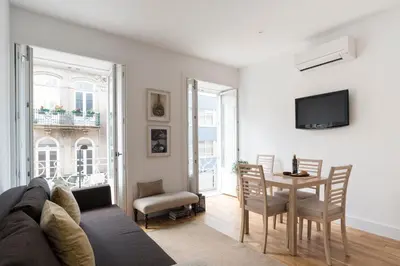 a living room with a couch and a table at Casa Oliveira in Porto