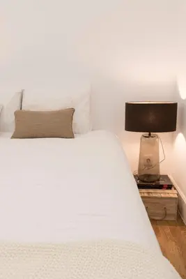 a white bathroom with a sink and a toilet at Casa Oliveira in Porto
