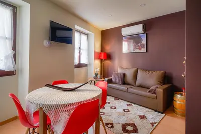 a living room with a table and a couch at Port Wine Flats in Vila Nova de Gaia