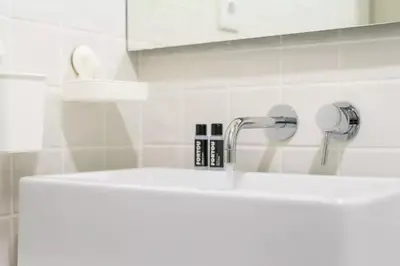 a white sink with a faucet in a bathroom at VIVA Historic Centre Downtown in Porto