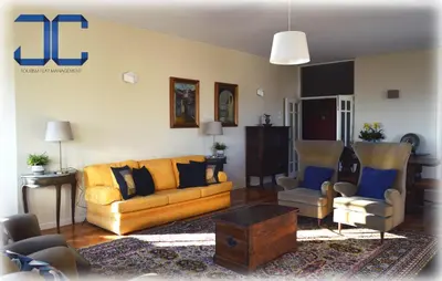 a living room with a couch and two chairs at Pardal Apartment by JC in Porto