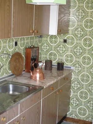 a kitchen with a sink and a tea kettle at Oportobestview-TopFlat in Porto