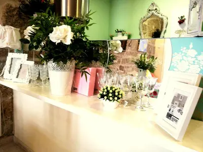a counter with vases of flowers and glasses on it at Cor Iesu House, Arts Quarter, Porto in Porto