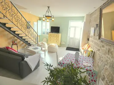 a living room with a couch and a table and a staircase at Cor Iesu House, Arts Quarter, Porto in Porto