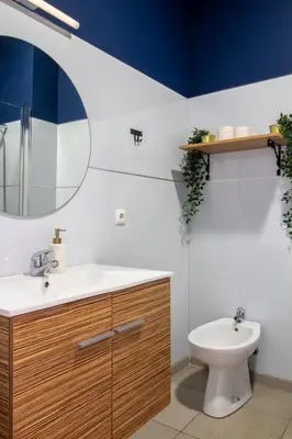 a bathroom with a sink and a toilet at LovelyStay - Aurora Heights Apartment in Porto