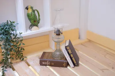 a book and a lamp sitting on a table at Casa Sá Noronha Old Town in Porto