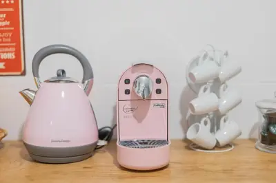 a pink blender and a tea kettle on a table at Casa Sá Noronha Old Town in Porto