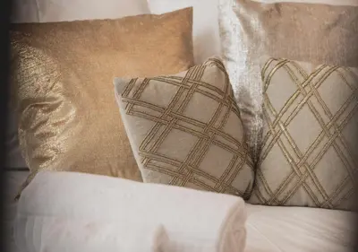 a group of pillows sitting on a bed at viterbo'8 - The Artists House in Porto